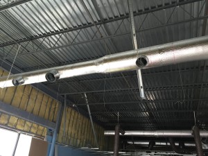 Installation of new duct for Carrier RTU.